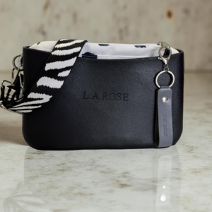 Cross body Body of the bag is made from Eva (Polyurethane) Inner is made from canvas and PU Zip for the main entry of the inner Two pockets on either side of the inner. The interchangeable strap is made from a strong canvas material.