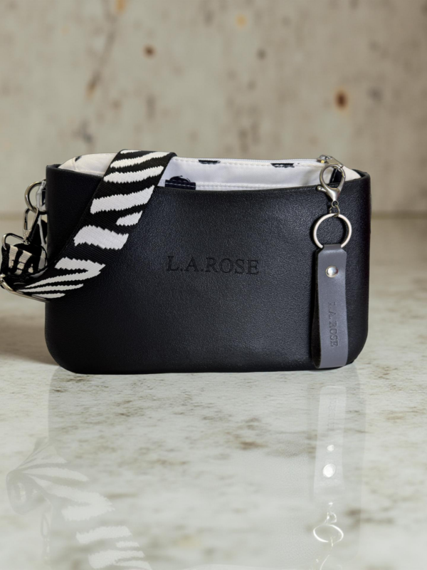Cross body Body of the bag is made from Eva (Polyurethane) Inner is made from canvas and PU Zip for the main entry of the inner Two pockets on either side of the inner. The interchangeable strap is made from a strong canvas material.